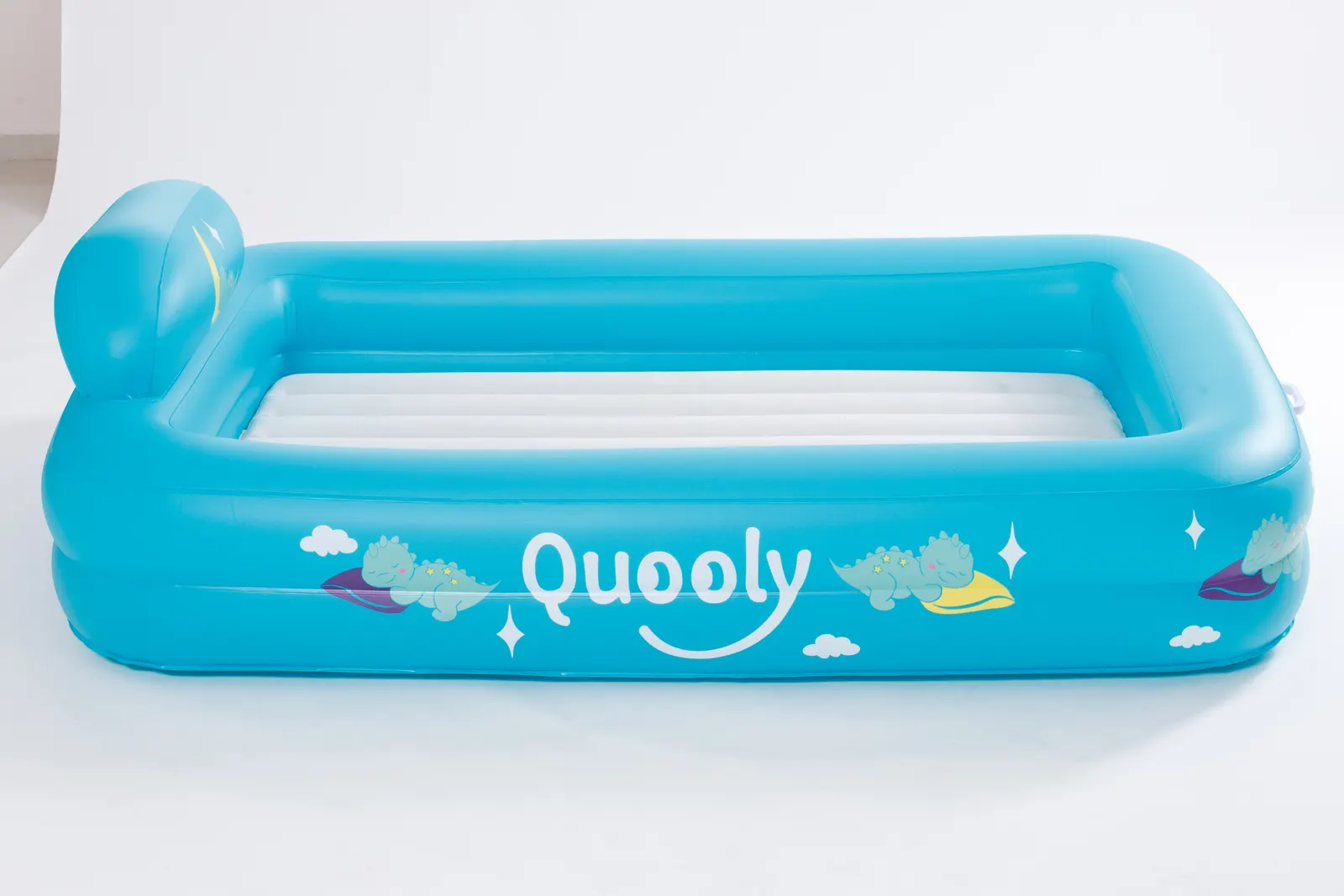 Quooly bed showing the raised 360 degree safety bumpers and headrest